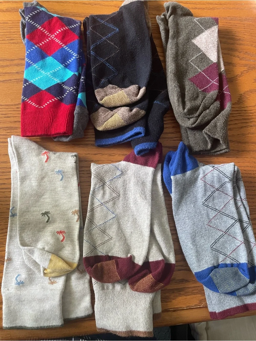 Six pairs socks, including some argyle & one tropical pattern